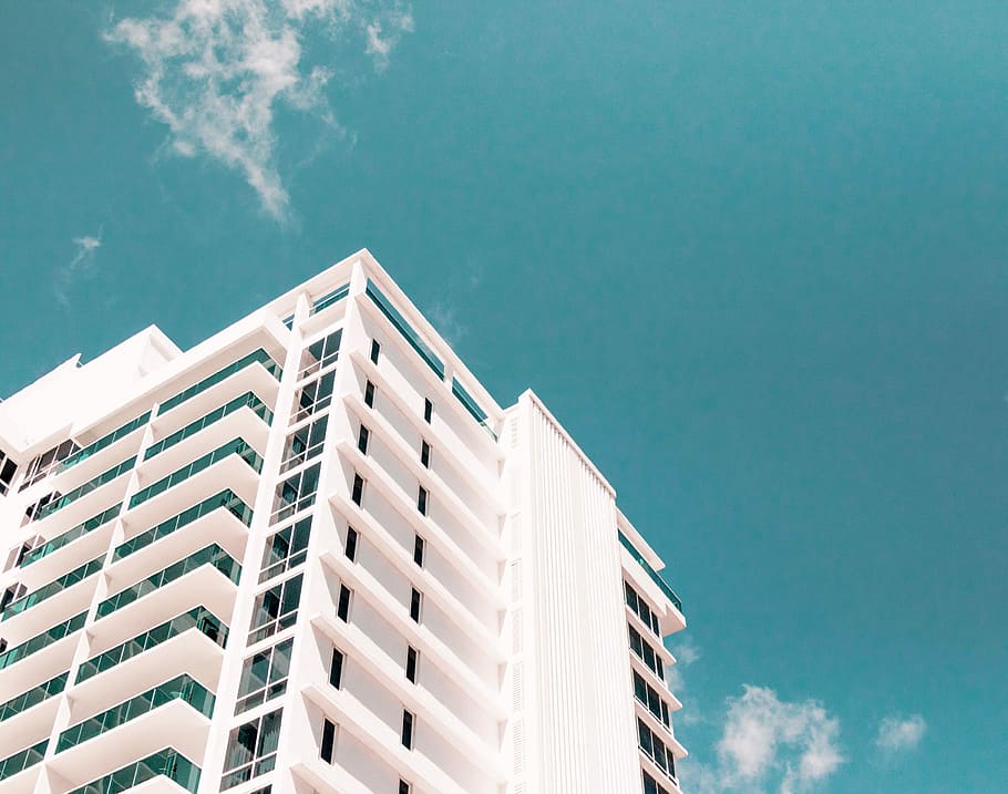 low-angle photography of white building, white building under blue sky HD wallpaper