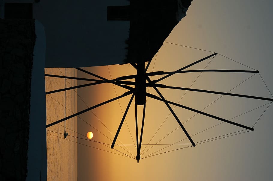 silhouette of boat on body of water, black industrial fan at sunset HD wallpaper