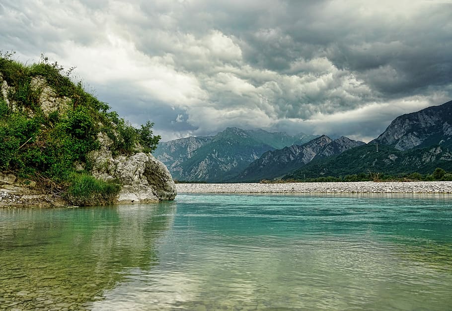 body of water near mountain alps under nimbus clouds, nature HD wallpaper