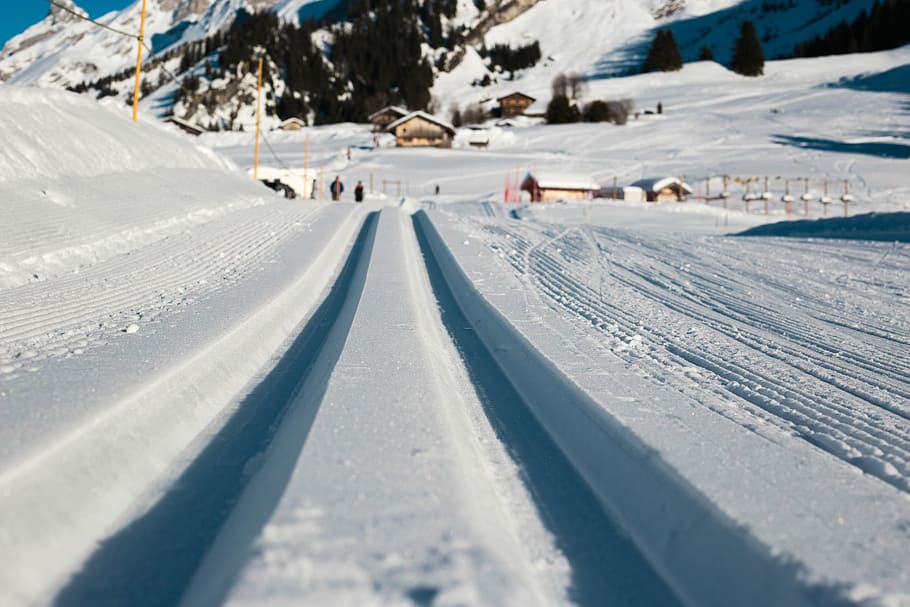 low angle photo of snow, snowtrail during daytime, tracks, building HD wallpaper