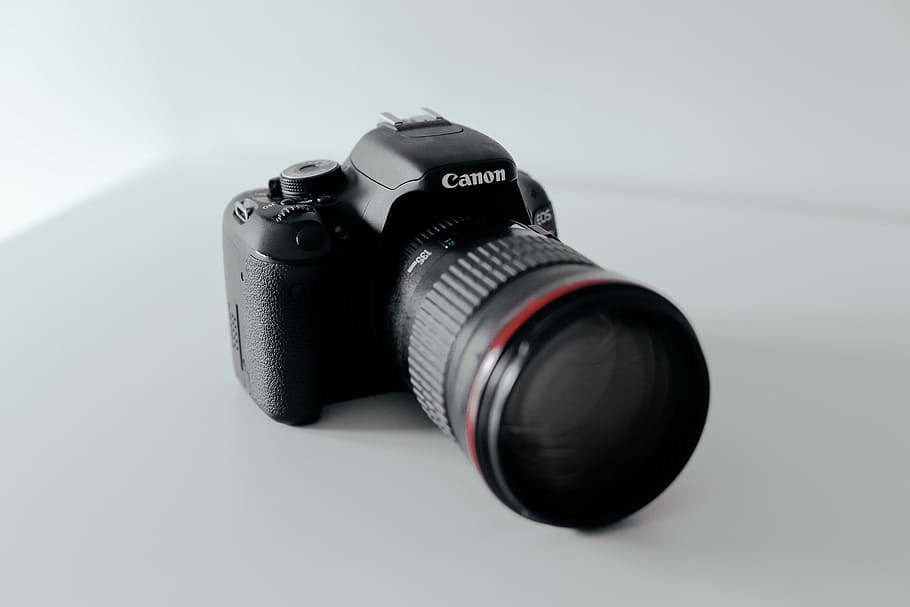 black Canon DSLR camera, black Canon DSLR camera on white surface HD wallpaper