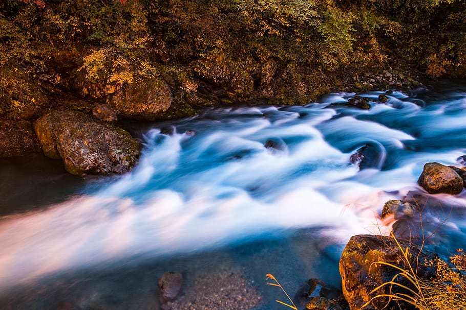 body of water in between of stones, timelapse photography of river HD wallpaper