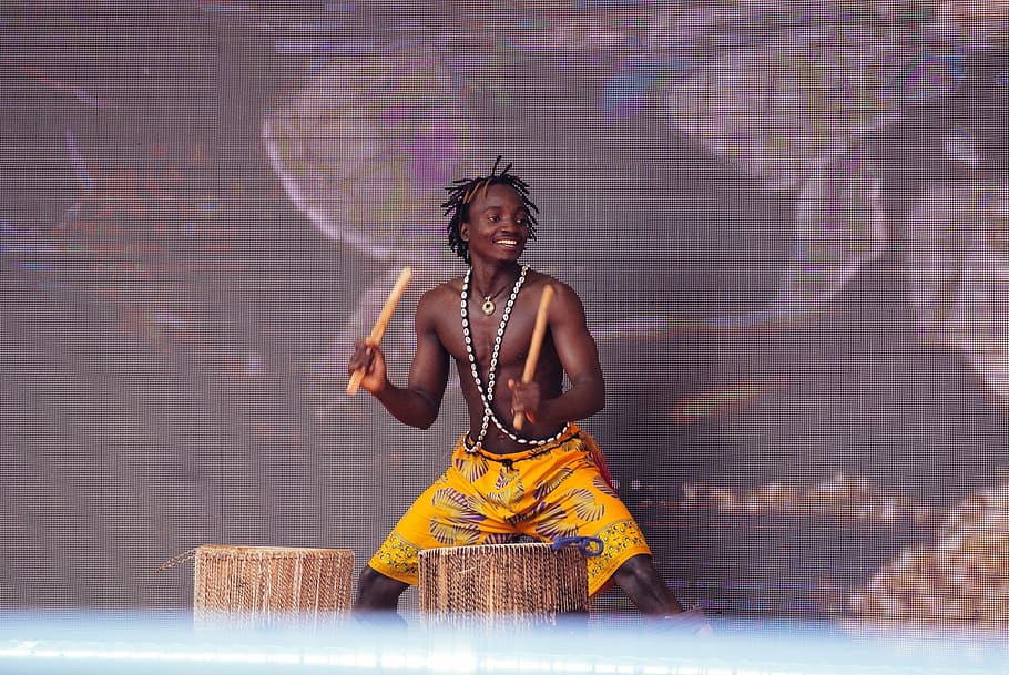 man playing brown wooden percussion drum, power, african man