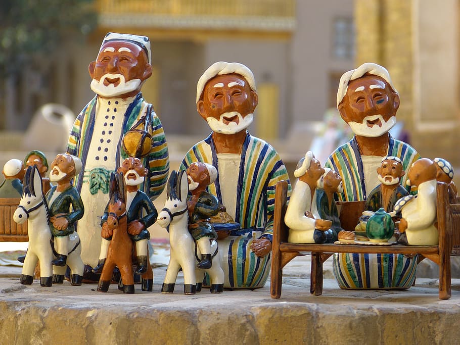 brown-and-white ceramic figurines, clay figure, uzbekistan, pottery