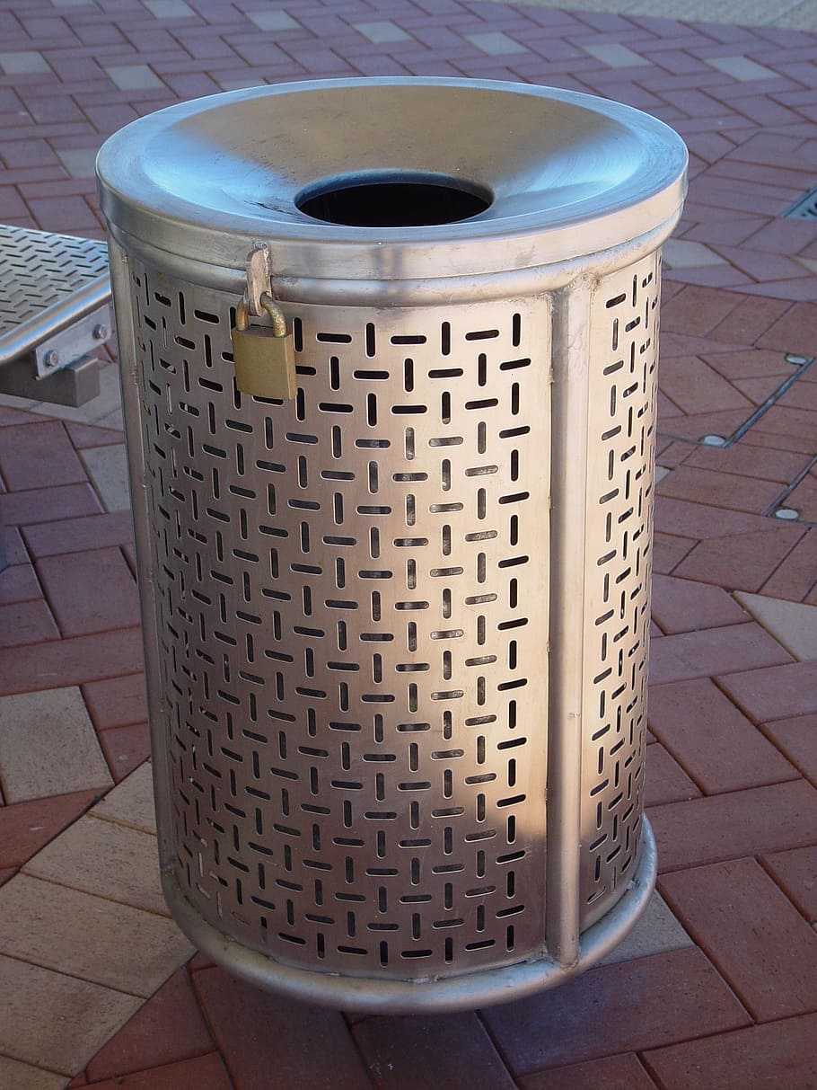 round gray metal trash bin on brown paver block, Steel, Stainless