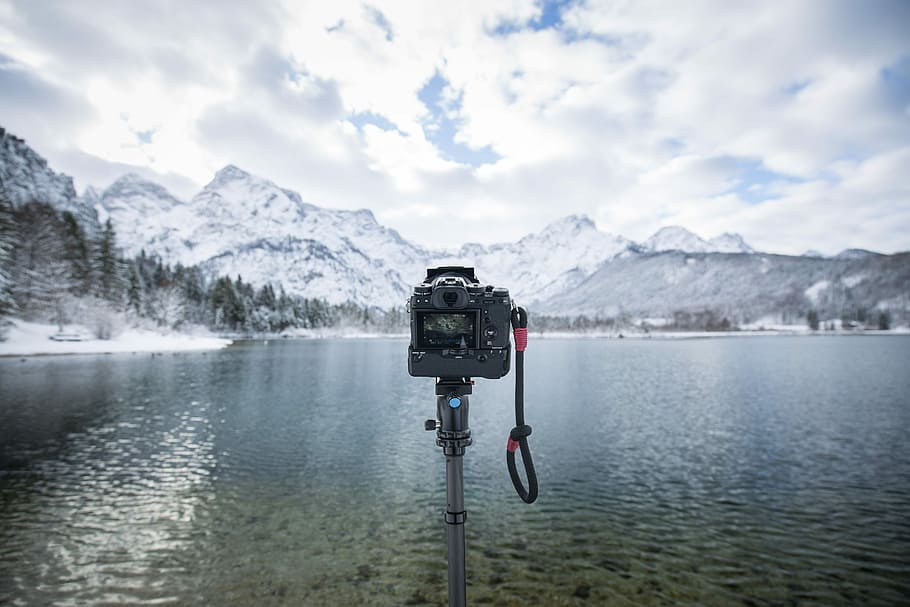 black camera with stand near water, photograph of camera in front of body of water HD wallpaper