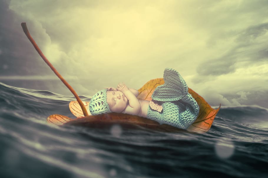 baby laying on leaf on body of water painting, child, wave, sea