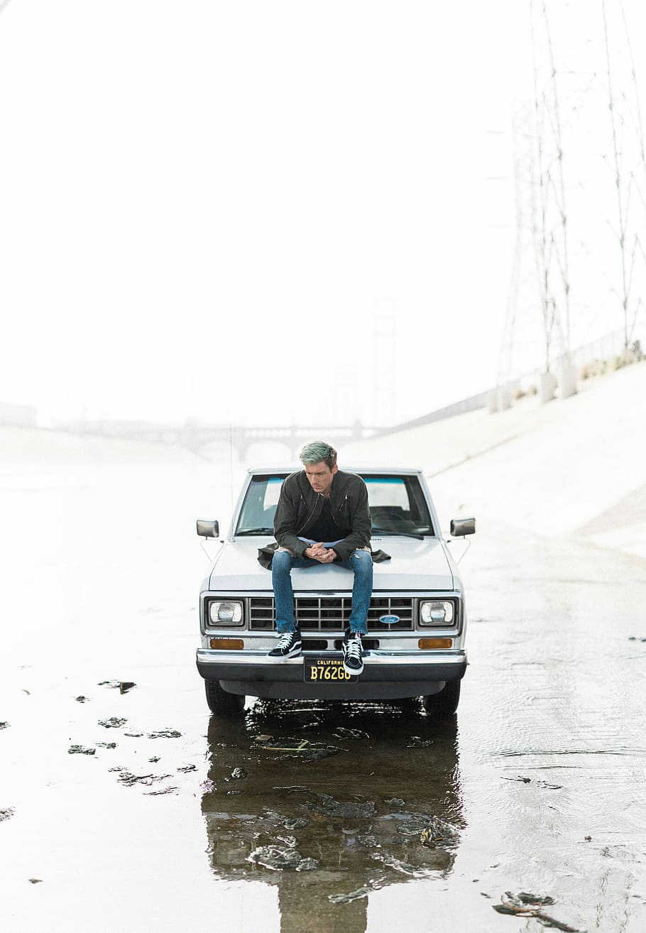 Online crop | HD wallpaper: man sitting on car hood, man sitting on ...