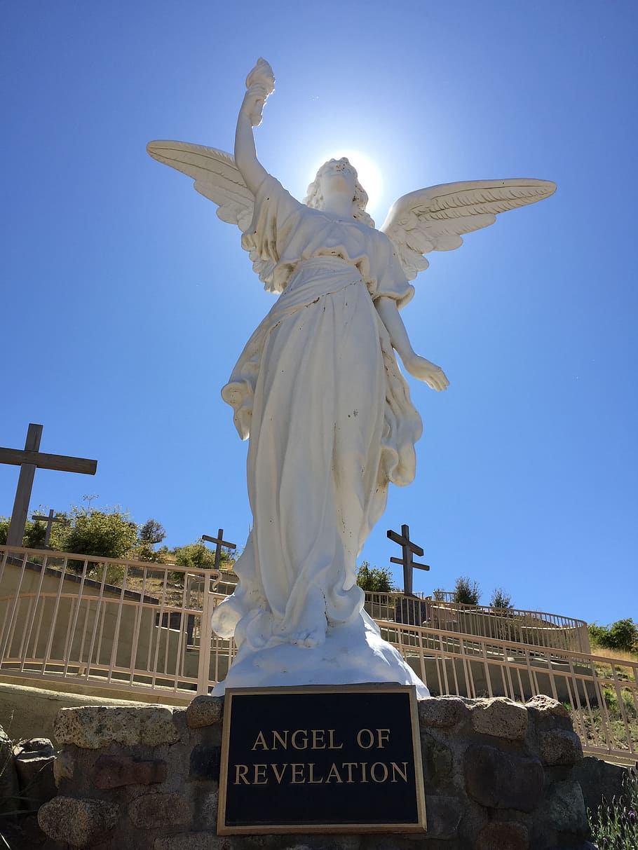 low-angle view pghoto of Angel of Revelation statue, heavenly