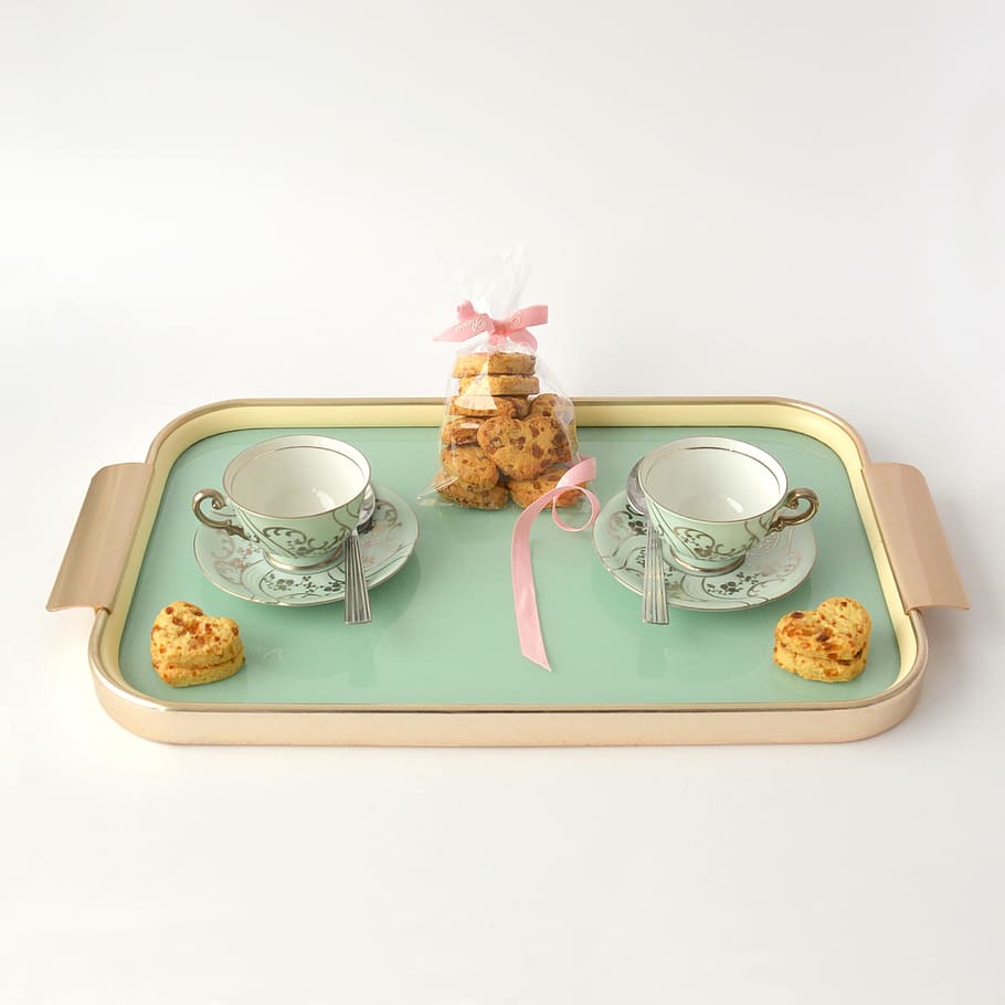rectangular beige and green tea set and packed cookies, two green ceramic teacup on saucers with baked cookies HD wallpaper
