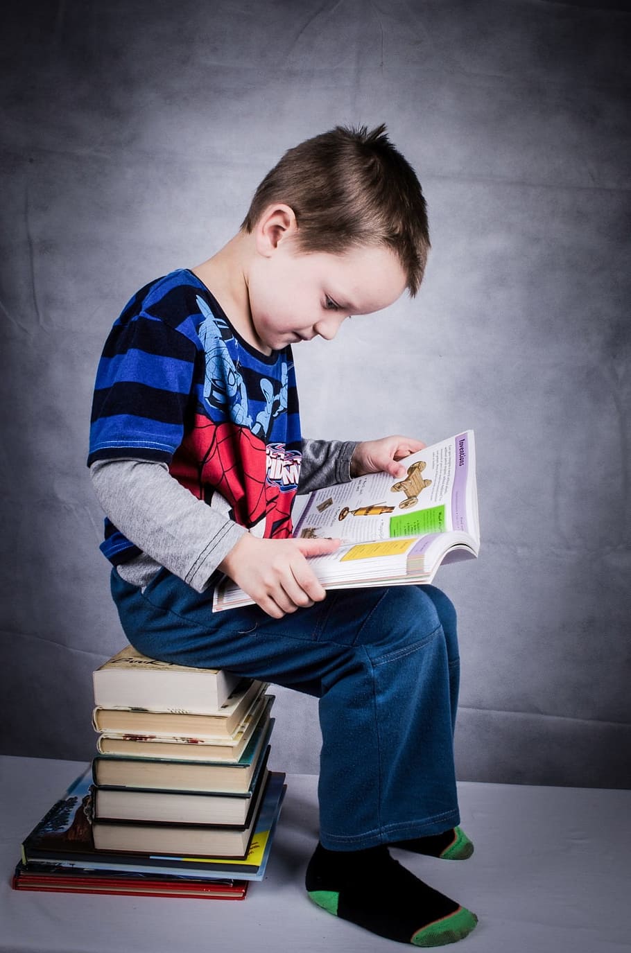 boy reading book sitting on stack of books, child, studying, educational, HD wallpaper