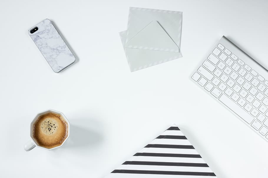 white ceramic cup beside iPhone 5s, coffee, work desk, mug HD wallpaper