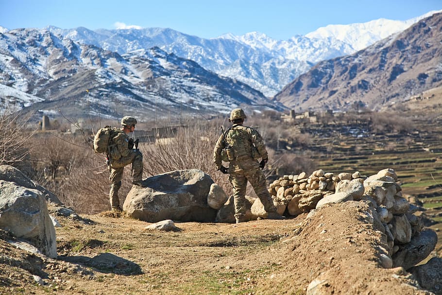 two soldiers on rocky ground during daytime, military, uniform