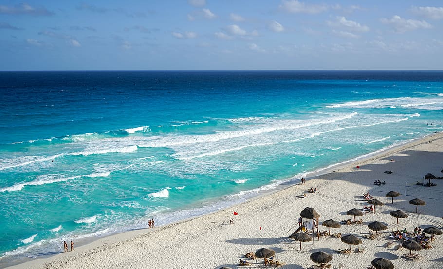 aerial photography of beach during daytime, cancun, mexico, huts