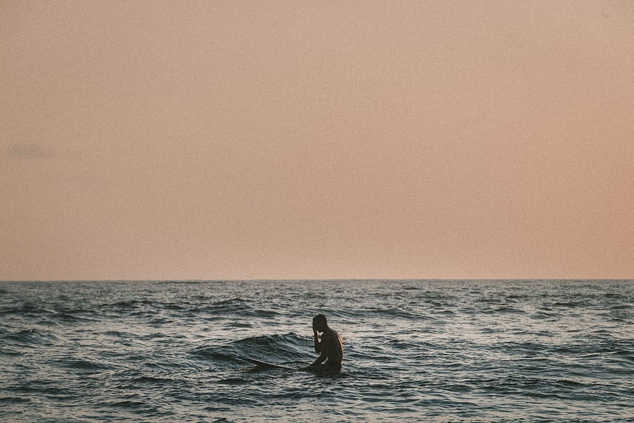 man standing on body of water, photography of surfer in the middle of the sea HD wallpaper