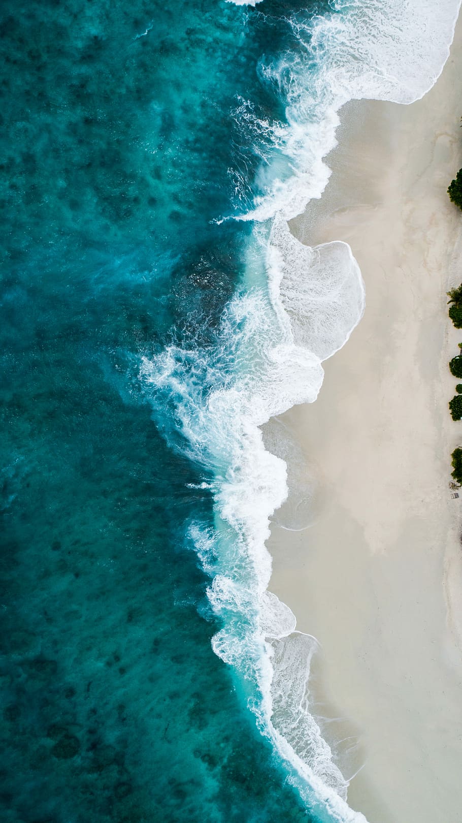 aerial photography of large body of water and shoreline, aerial photo of seashore waves during daytime