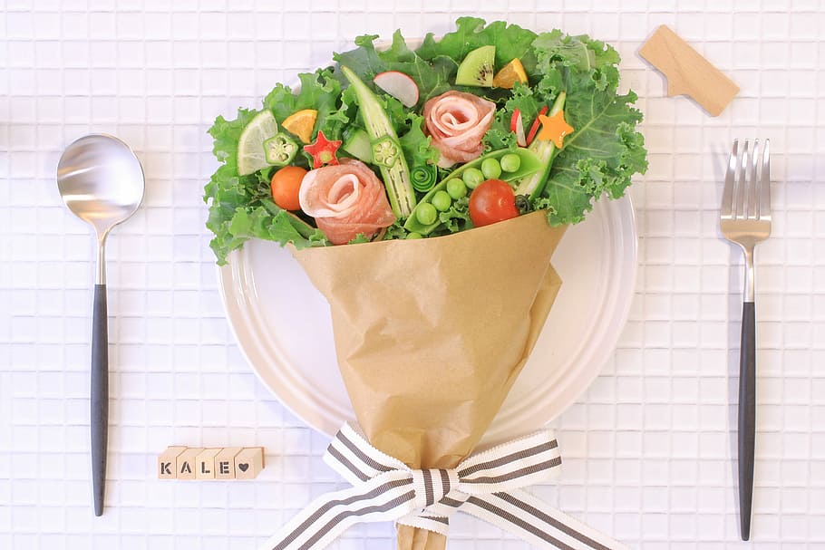 vegetable bouquet on white ceramic plate with spoon and fork HD wallpaper