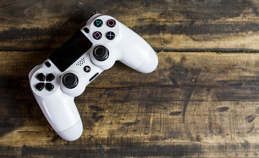top-view angle photo of PS4 DualShock controller on beige surface, HD wallpaper