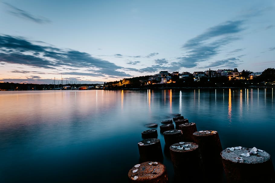 landscape photography of city near body of water, seadock, coast HD wallpaper