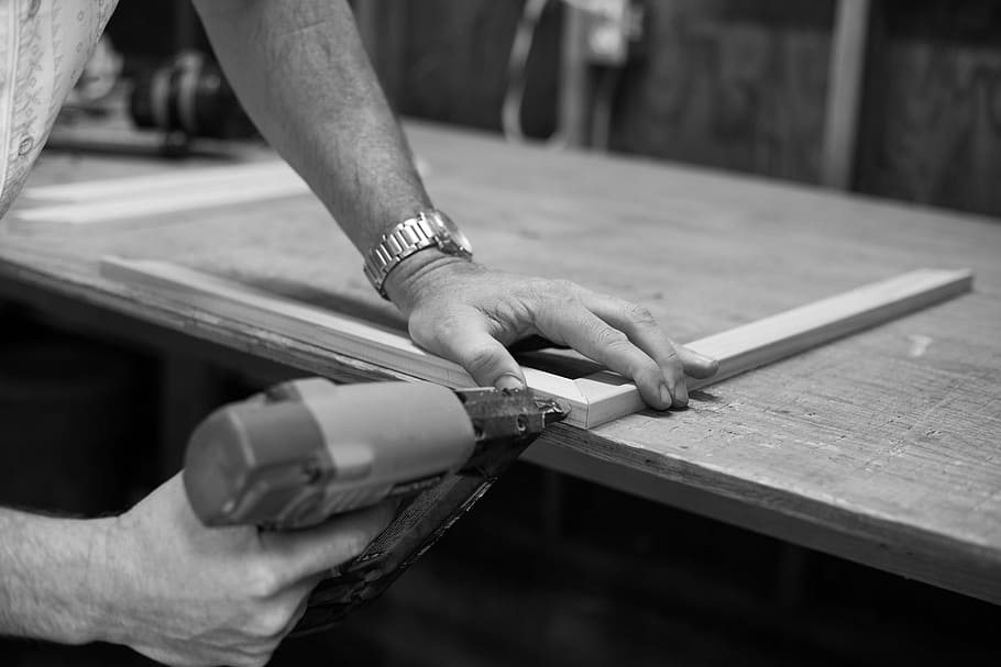 person doing wooden frame, grayscale photography of person wearing wristwatch HD wallpaper