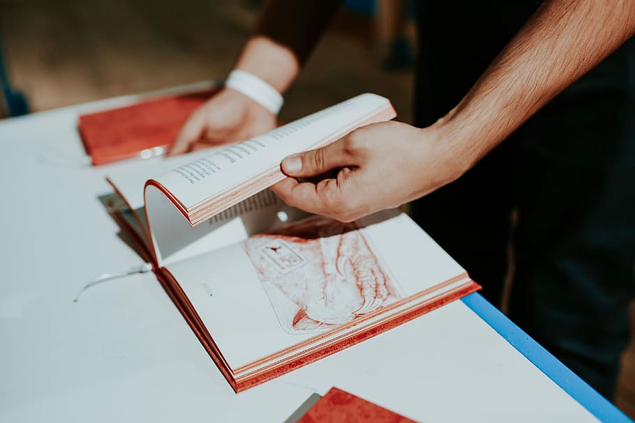Red book on a white table, reading, literature, cookbook, people HD wallpaper