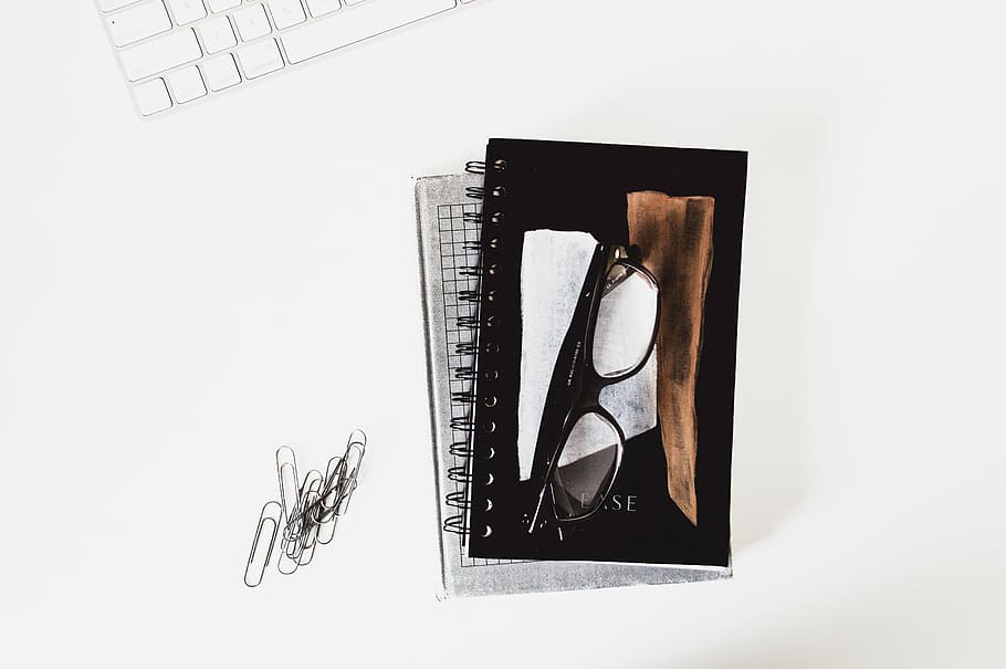 eyeglasses with black frames on book, black framed eyeglasses on book HD wallpaper