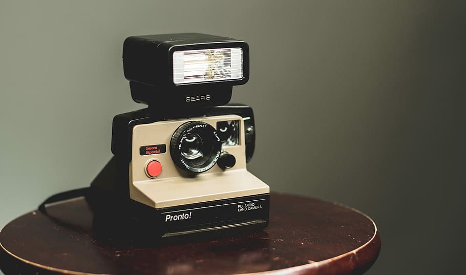 white and black camera on top of brown wooden table, beige and black land camera on top of brown table HD wallpaper