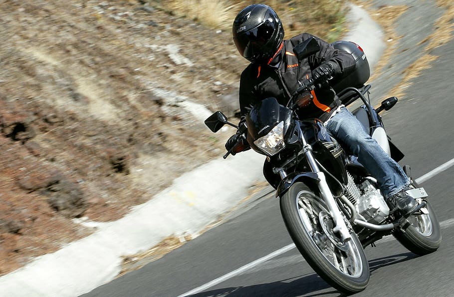 selective focus photo of man riding standard motorcycle, road HD wallpaper