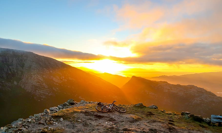scenery of mountains, photo of bike near edge of cliff, sunrise HD wallpaper