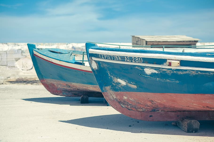 two blue-and-brown boat beside each other, two blue boats on ground HD wallpaper