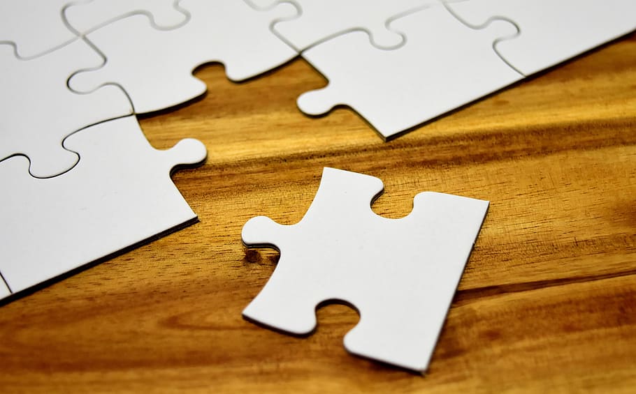 close-up of puzzle board, joining together, insert, share, fit