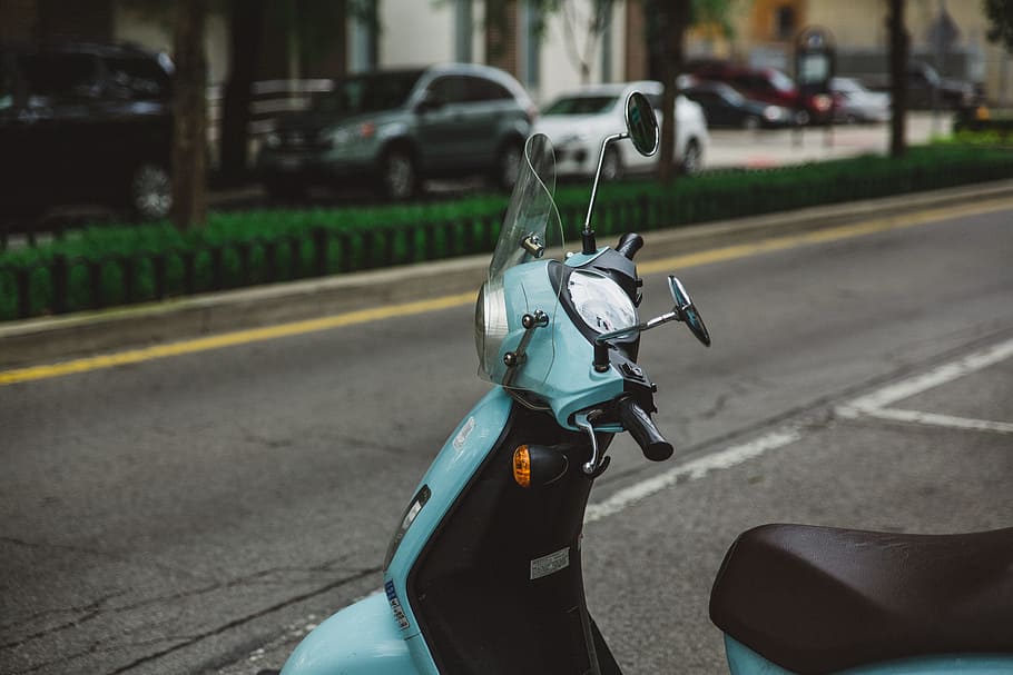 blue motor scooter parked beside road, shallow focus photography of teal and black motor scooter, HD wallpaper