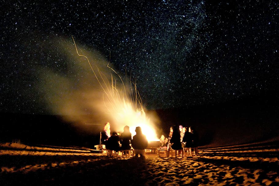 silhouette photography of group of people surrounding on bonfire, silhouette of people in front of bonfire HD wallpaper