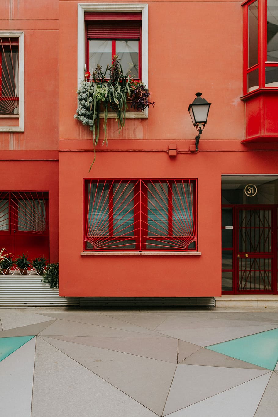 orange painted concrete house, closeup photography of red concrete building \ HD wallpaper