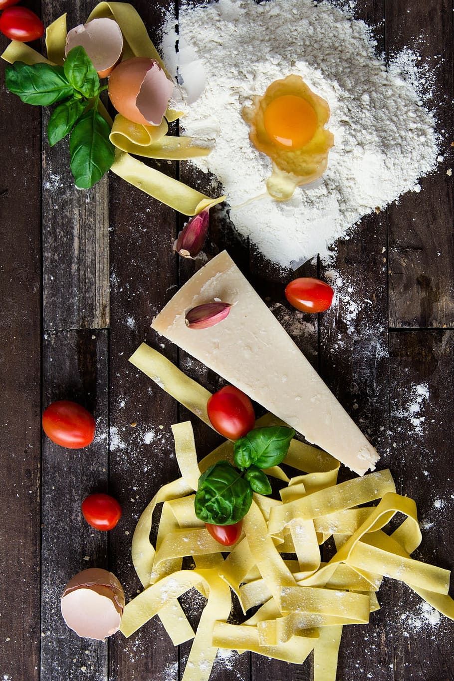 assorted foods on brown surface, pasta, cheese, egg, italian