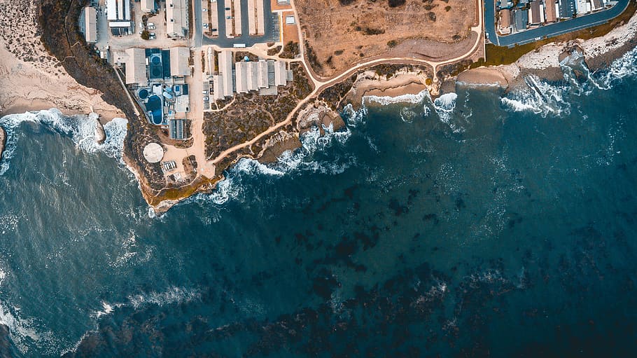 aerial photograph of seashore, aerial photo of buildings near body of water HD wallpaper