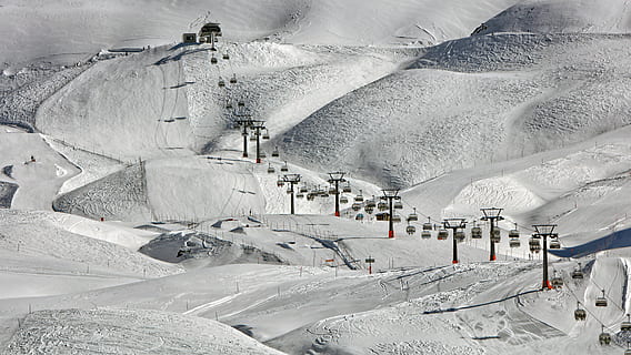 high-angle photography of cable cars near snow ground, cable cars above snow-covered field during daytime HD wallpaper