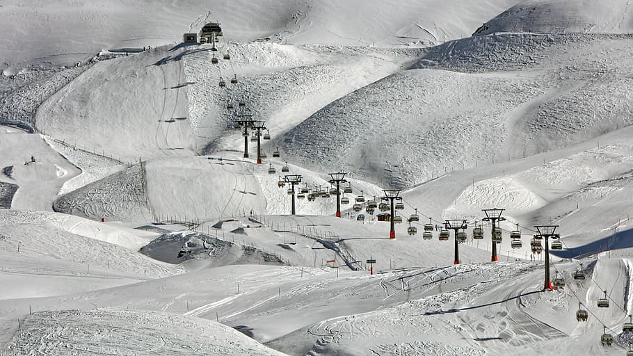 high-angle photography of cable cars near snow ground, cable cars above snow-covered field during daytime HD wallpaper