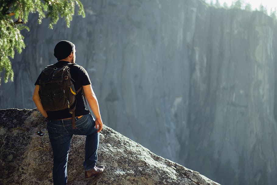 man standing on cliff at daytime, nature, mountains, trees, people, HD wallpaper