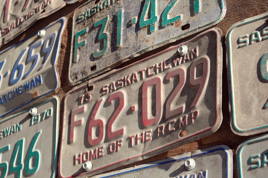 licence plates on wall, car, automobile, vehicle, province, letters