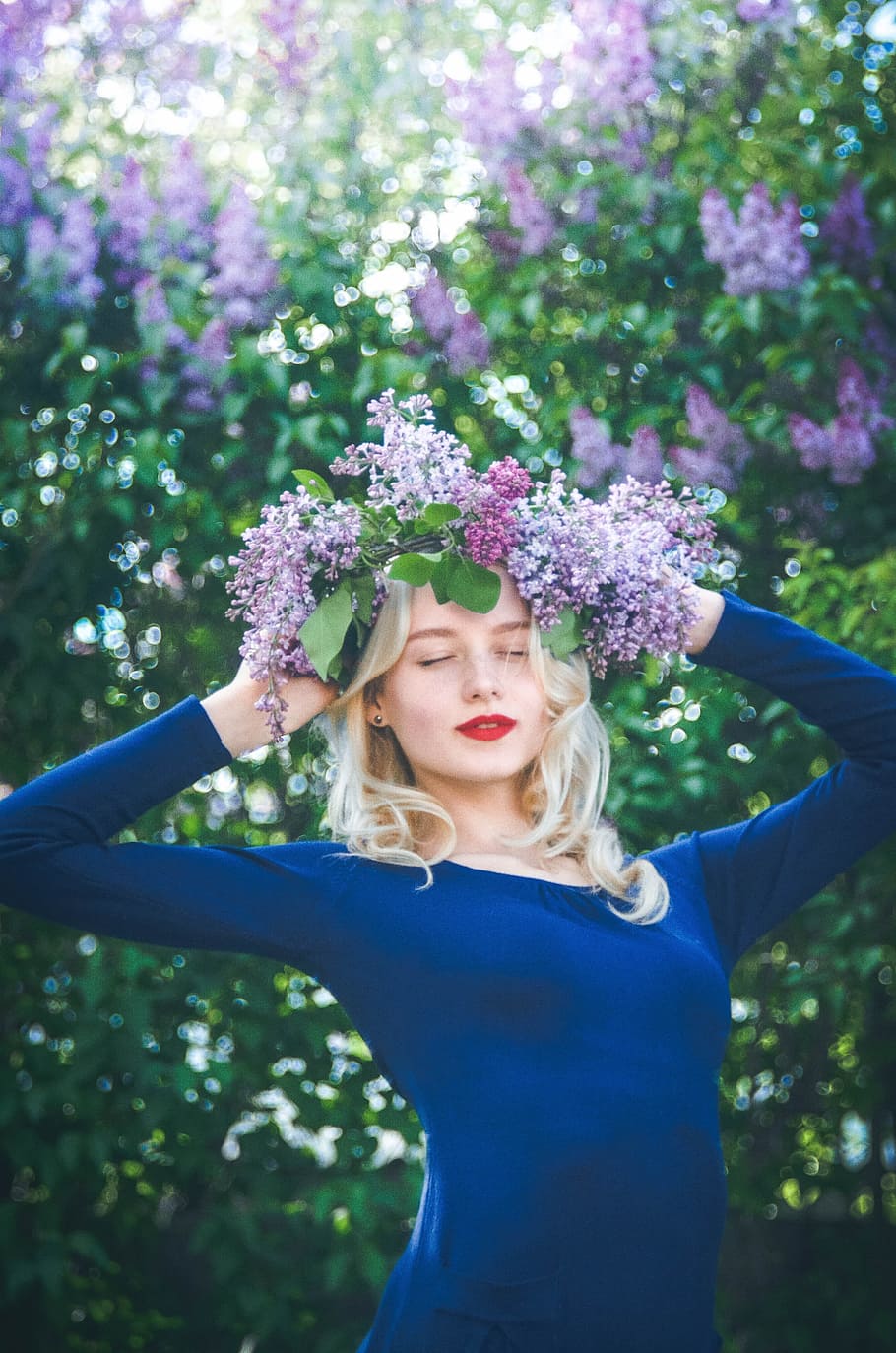 woman wearing blue long-sleeved shirt with purple flowers, girl