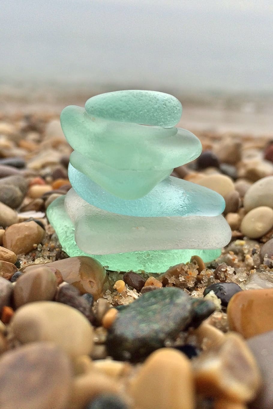 stack of green stones, beach glass, coast, sea, water, shore
