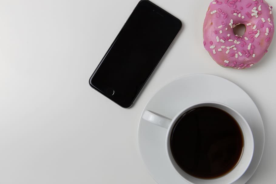 Coffee cup, iPhone mobile smartphone and donut on white desk, HD wallpaper