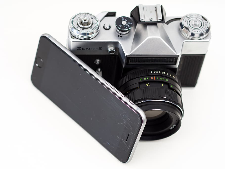 gray Zenit-E camera beside black smartphone, iphone, ios, iphoto
