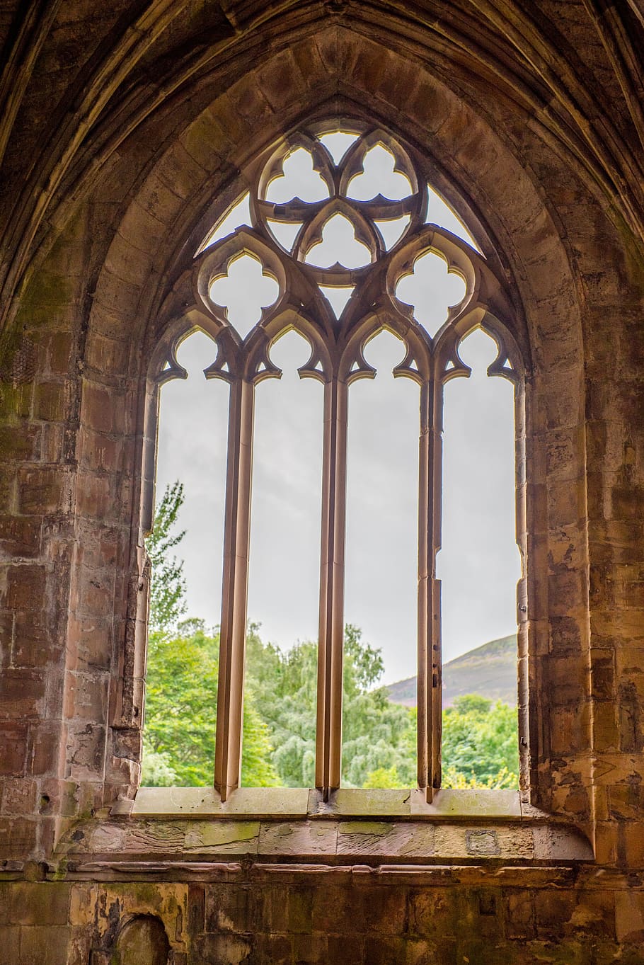 beige metal bars window, melrose abbey, scotland, church, stone