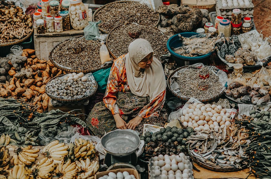 woman selling fruits at the market, woman surrounded by variety of fruits, HD wallpaper