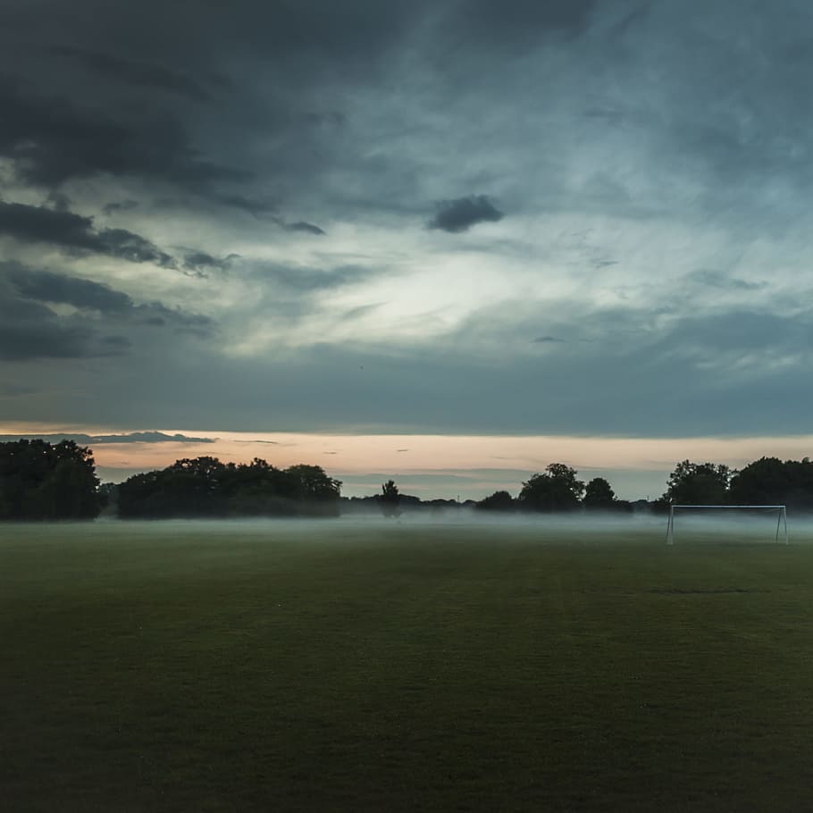 brown soccer field under cloudy sky, grass field under cloudy sky HD wallpaper