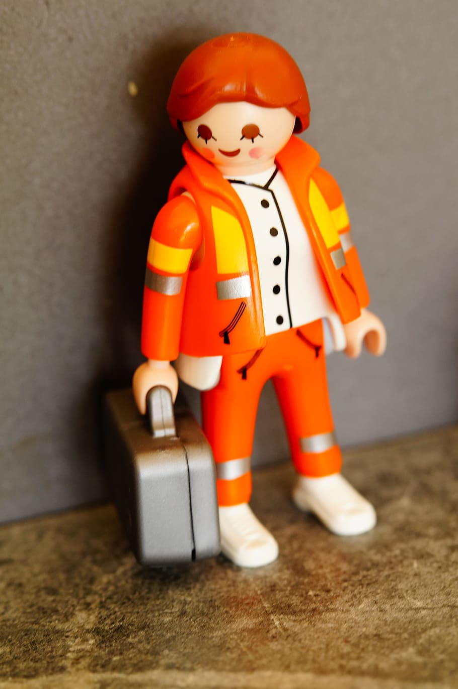 human in orange suit toy, medic, paramedic, doctor on call, emergency, HD wallpaper