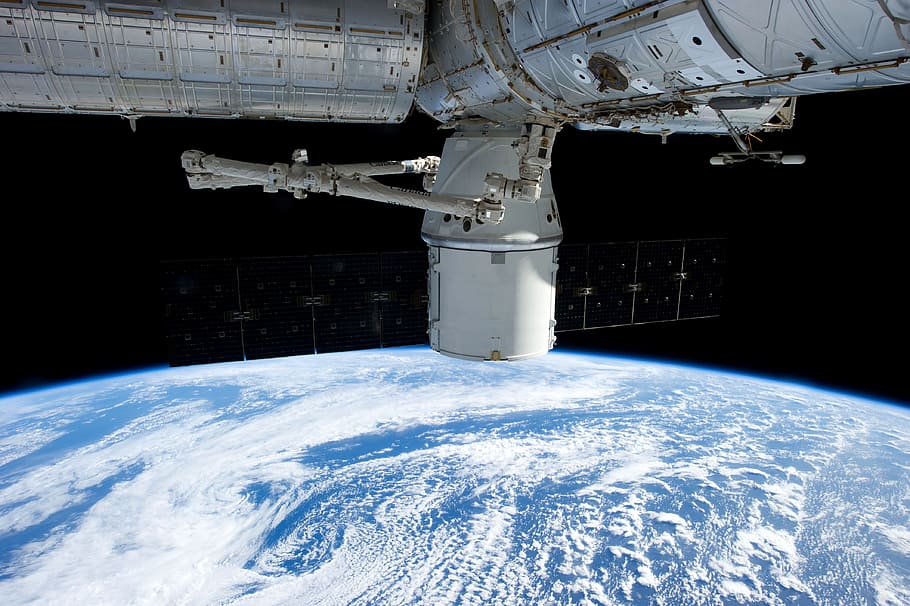 white satellite orbiting earth, spacex, aeronautics, nasa, science HD wallpaper