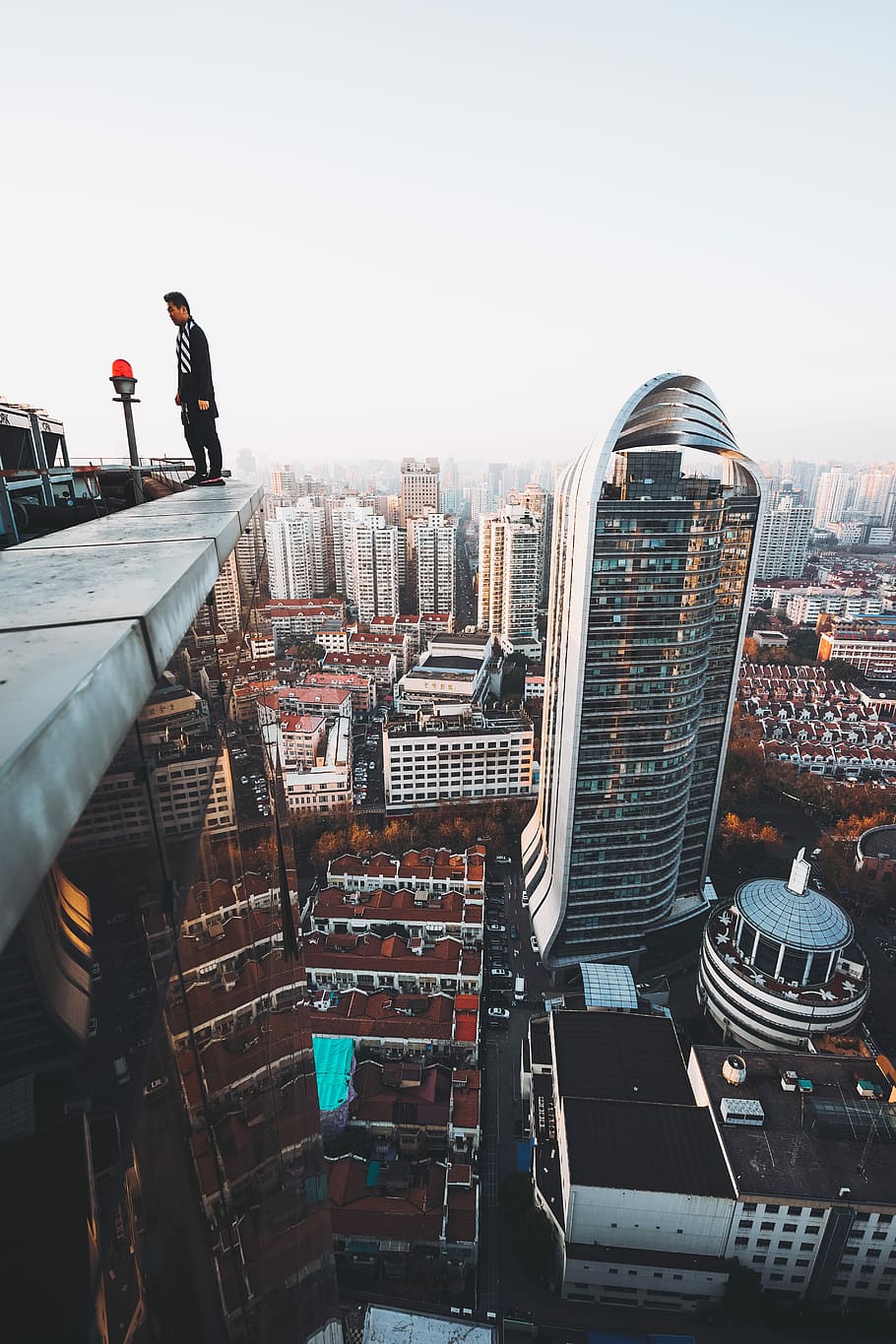 HD wallpaper: Mirror’s Edge, man standing on edge of building's rooftop